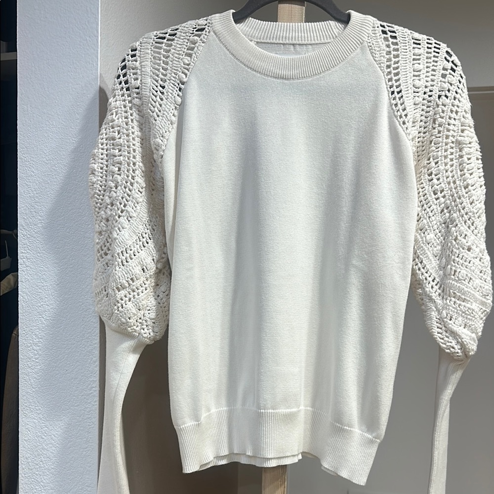 Saylor cotton knit top with crochet sleeves.